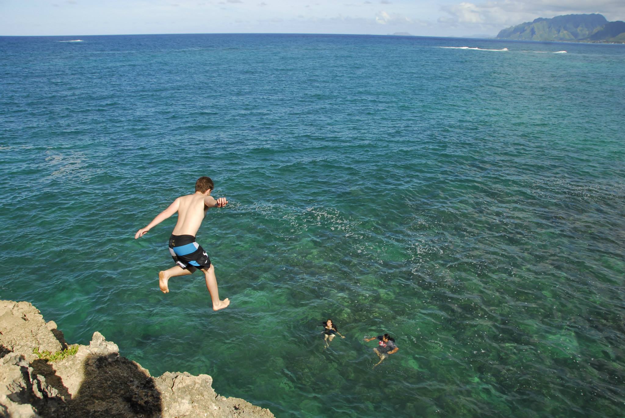 Dr. Potter jumping into the ocean in Hawaiʻi
